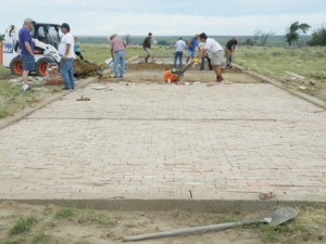 Volunteers laying bricks. Photo courtesy Amache Preservation Society.