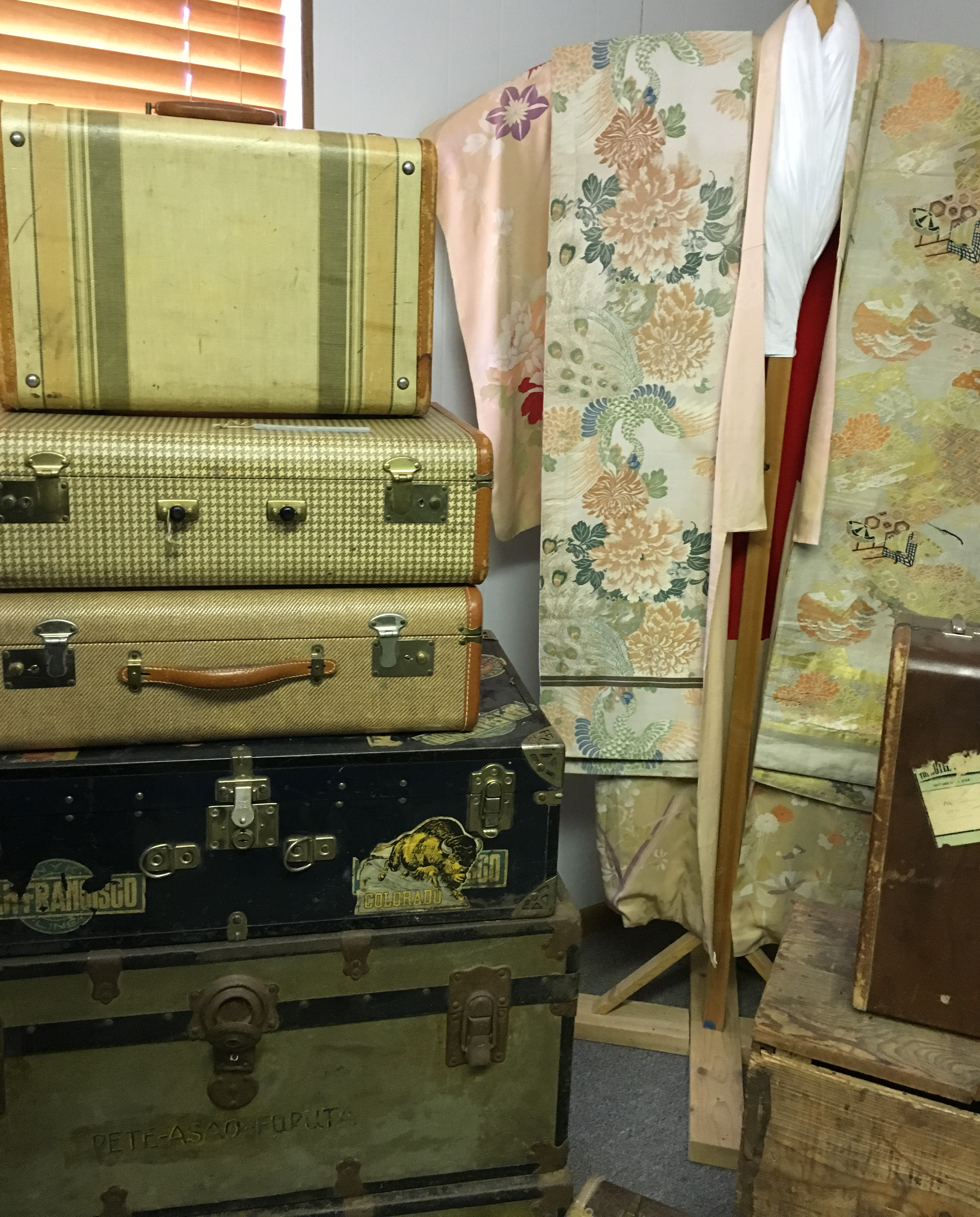Suitcases and kimono on display at the Amache Museum. Photo by Terri Holden.