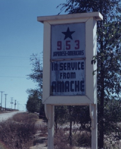 In Service from Amache sign. APS McClelland collection photo.
